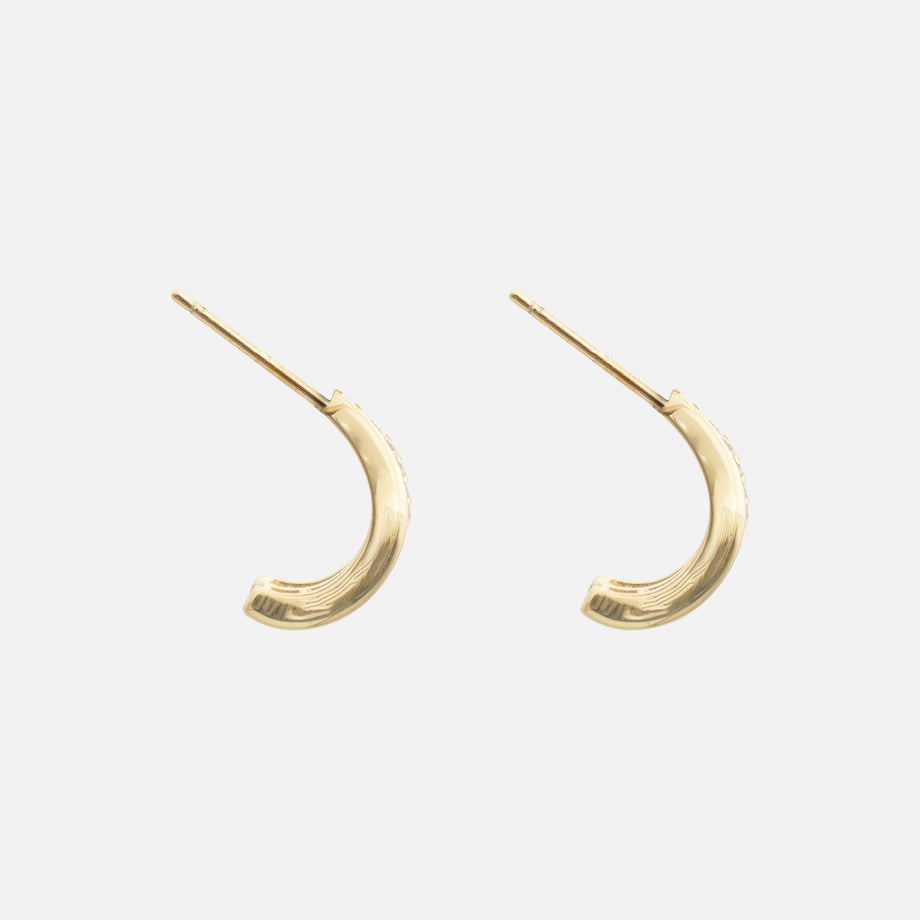 side view of Aurea Double Hoop Earrings,  crafted from a 925 sterling silver base with 18k gold plating and a pave hoop