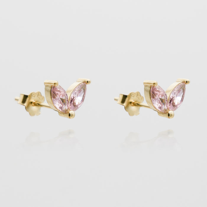 Gold earrings with pink gemstones.