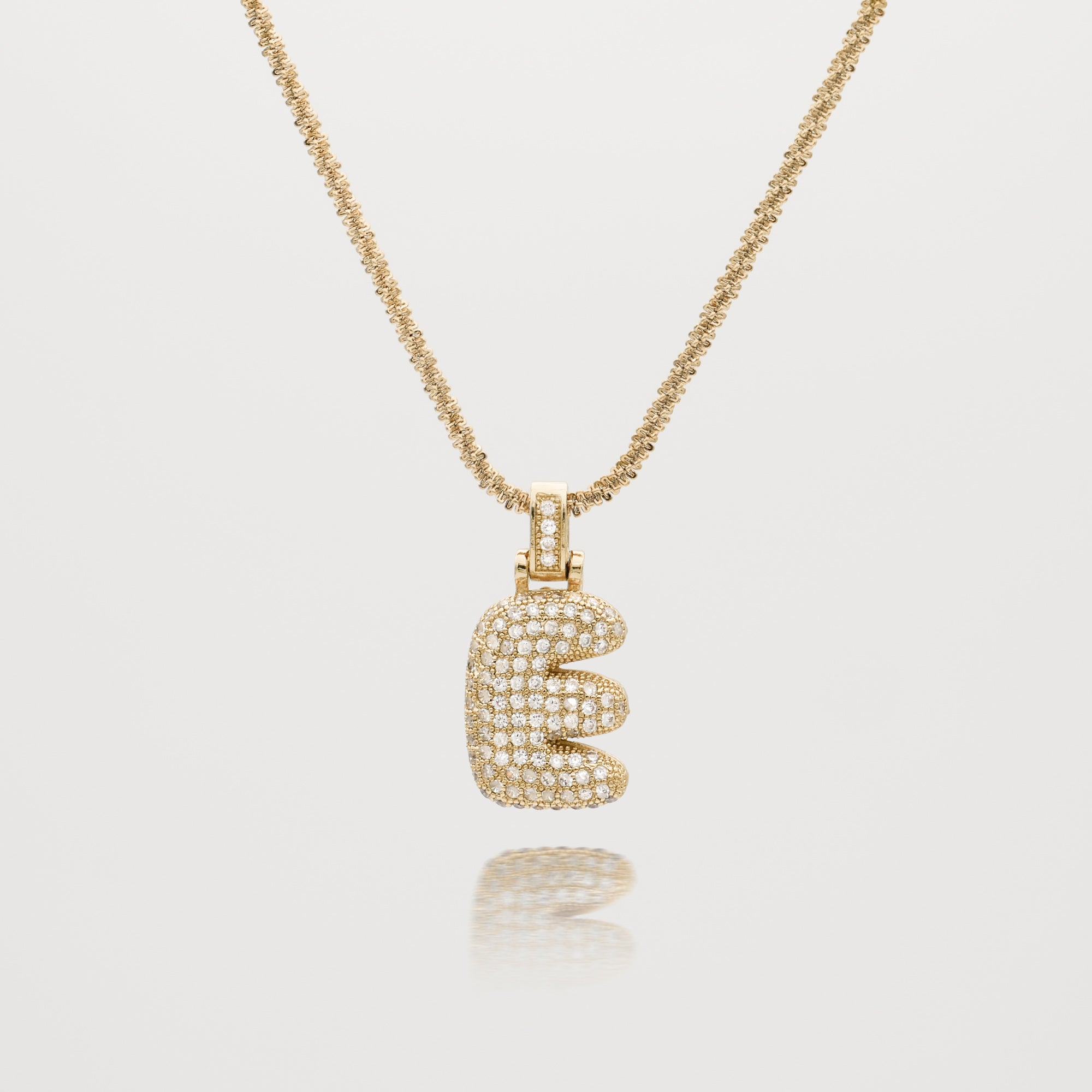 Pave Bubble Letter Initial Necklace encrusted with radiant CZ stones in gold tennis chain