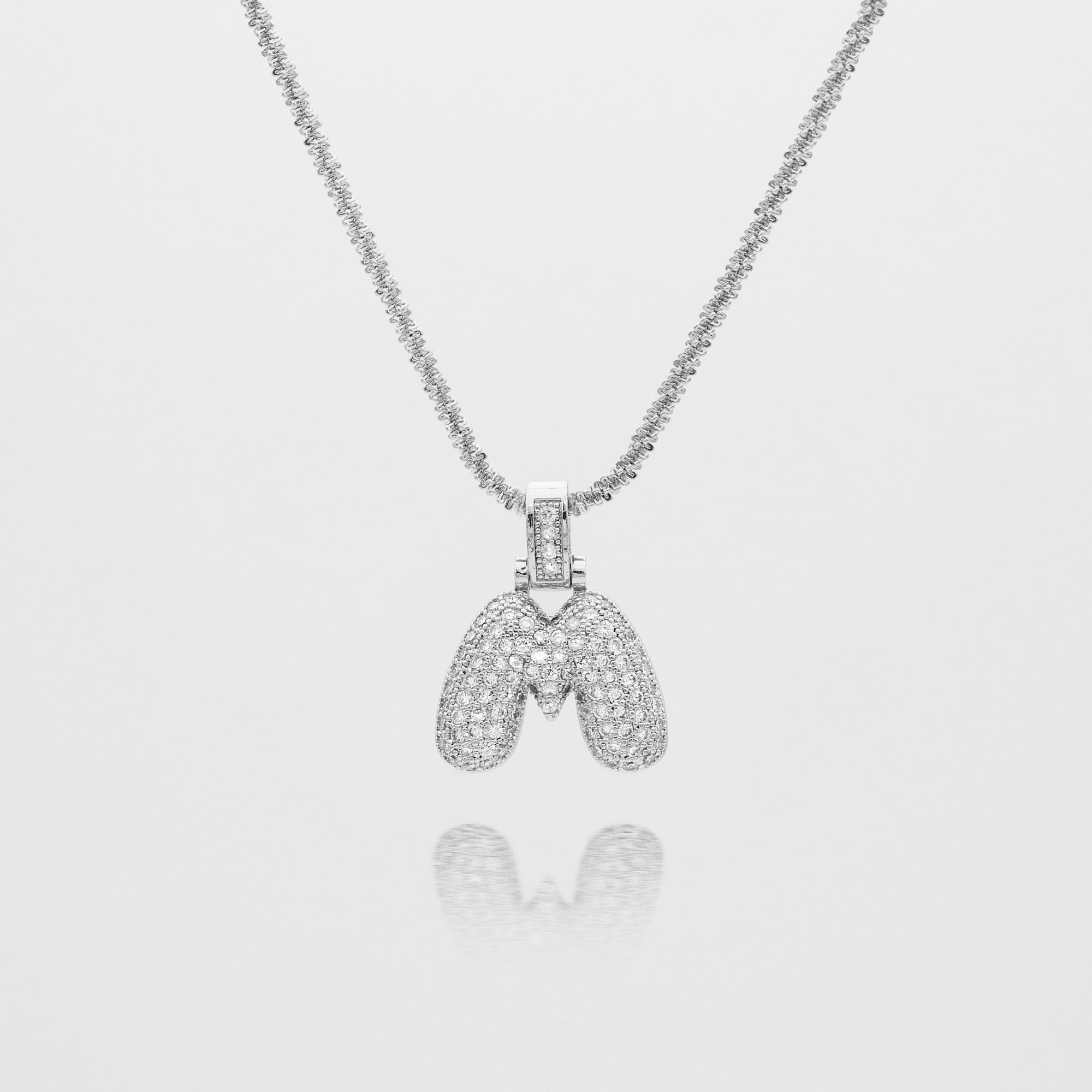 Pave Bubble Letter Initial Necklace encrusted with radiant CZ stones in silver tennis chain