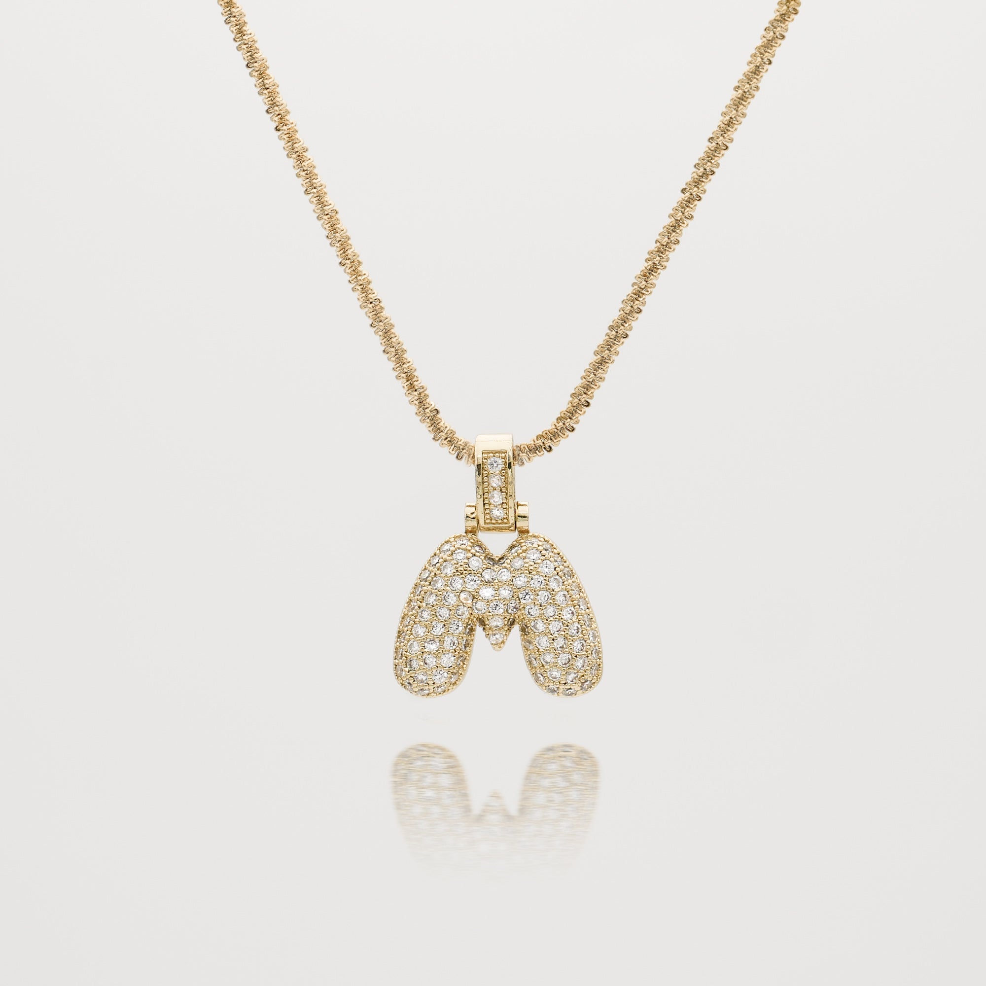 Pave Bubble Letter Initial Necklace encrusted with radiant CZ stones in gold tennis chain