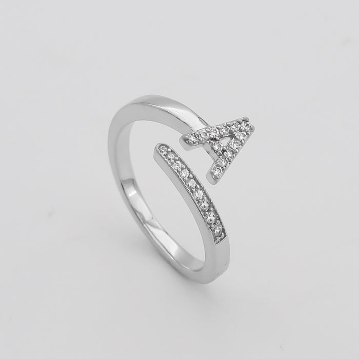 Model wearing Silver Paved, adjustable Icy initial ring in A