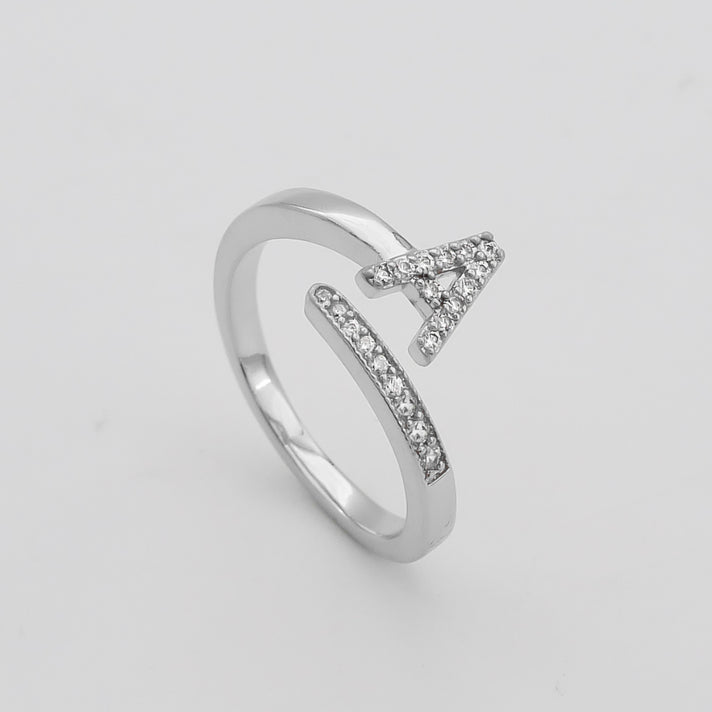 Model wearing Silver Paved, adjustable Icy initial ring in A