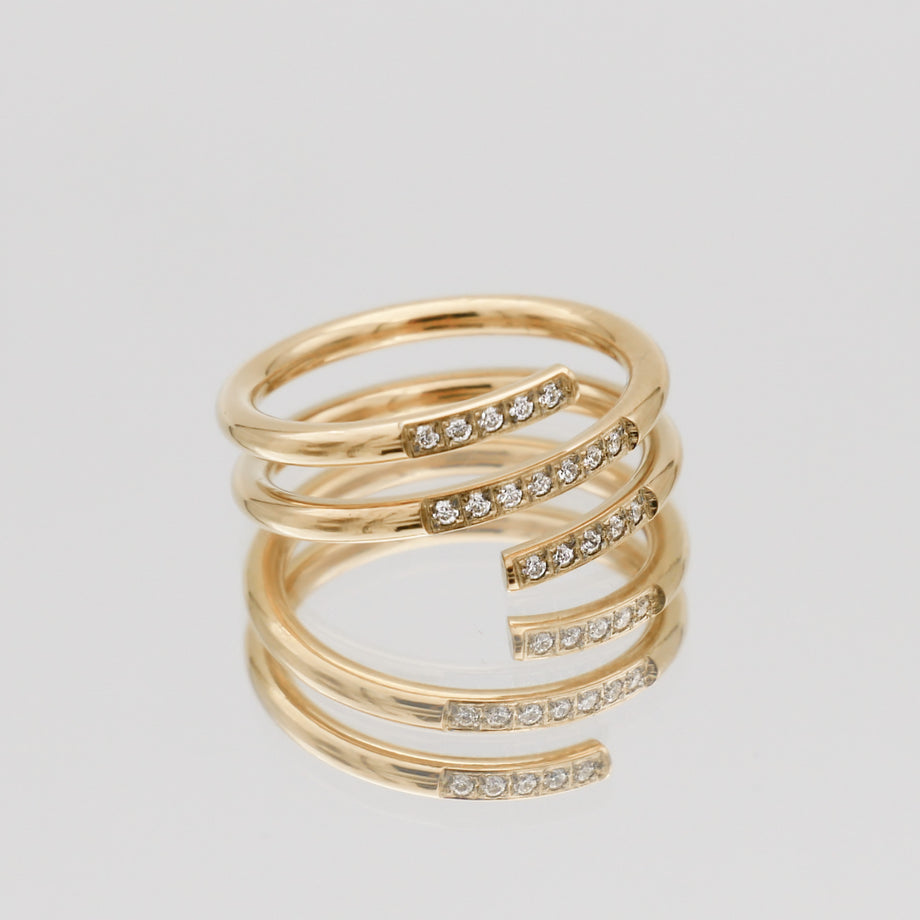 Gold layered ring with sparkling gemstones.