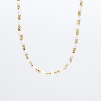 The Eden Pearl Bead Necklace, features delicate gold plated bamboo shaped beads and lustrous pearls from PRYA