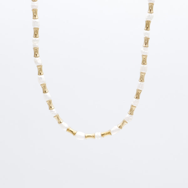 The Eden Pearl Bead Necklace, features delicate gold plated bamboo shaped beads and lustrous pearls from PRYA