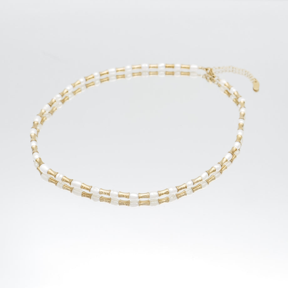 The Eden Pearl Bead Necklace, features delicate gold plated bamboo shaped beads and lustrous pearls from PRYA