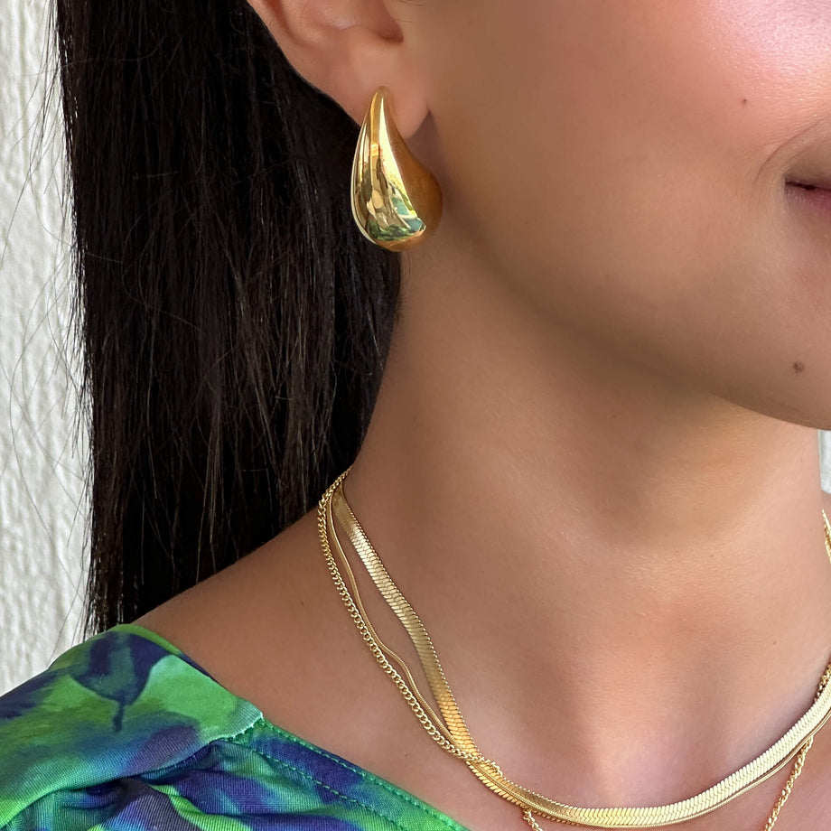 model wearing ella drop earrings 18k gold plated from prya