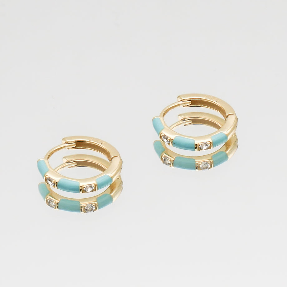 Gold and turquoise hoop earrings with crystals.