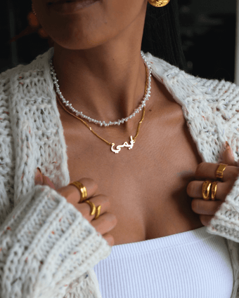 model wearing Arabic name necklace in 18k plated gold from prya