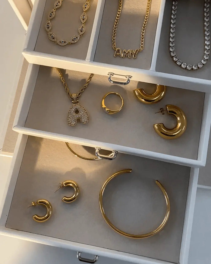 Jewellery box filled with Prya jewellery, including bracelets, earrings and necklaces
