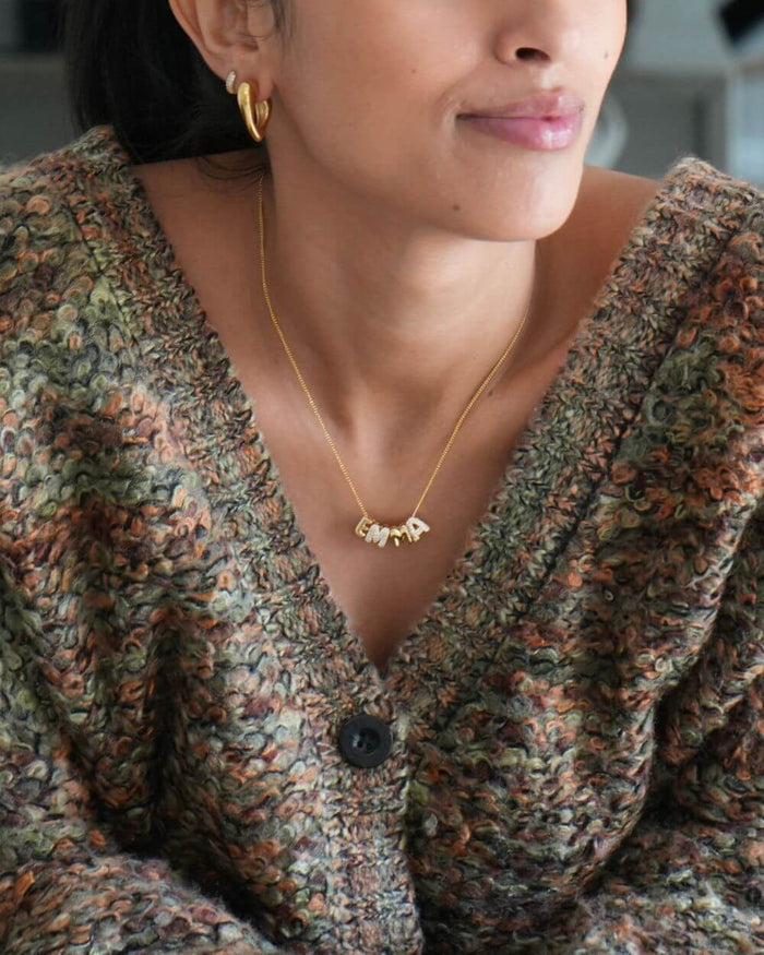 model wearing personalised bubble charm necklace from prya