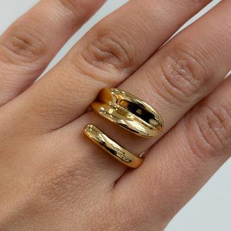 model wearing Gianna Wrap Ring, double cross over wrap ring, crafted in 18k gold plated stainless steel from prya