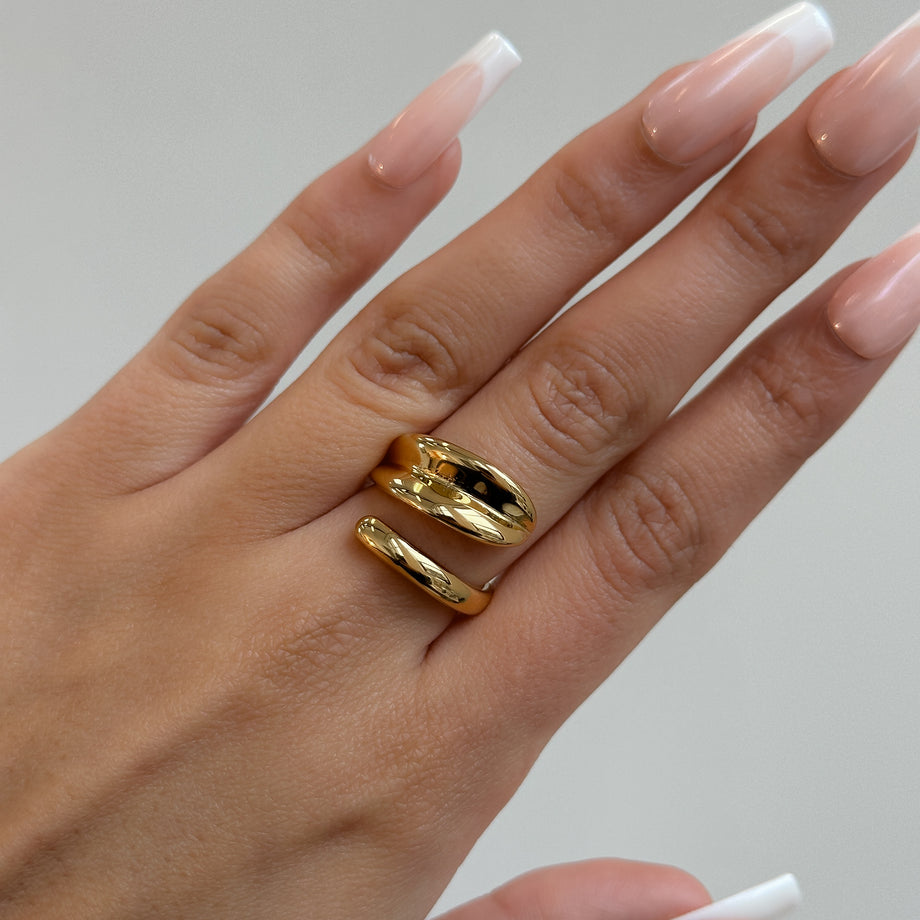 model wearing Gianna Wrap Ring, double cross over wrap ring, crafted in 18k gold plated stainless steel from prya