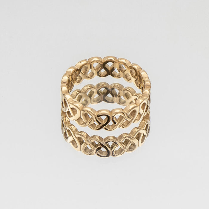 Hallie Ring features a striking gold plated band with a Celtic-inspired design, adorned with a classic love knot from Prya