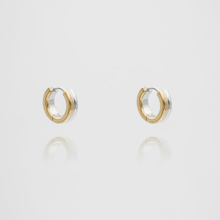 Two-tone circular Hana Earrings on white background.