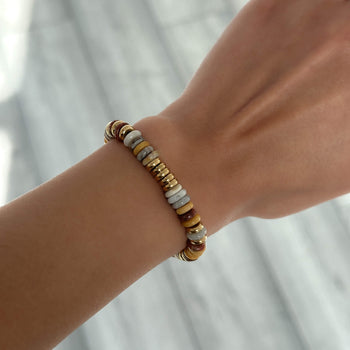 model wearing Harmony bracelet, crafted in 18k Gold plated stainless steel and adorned with natural stones from Prya