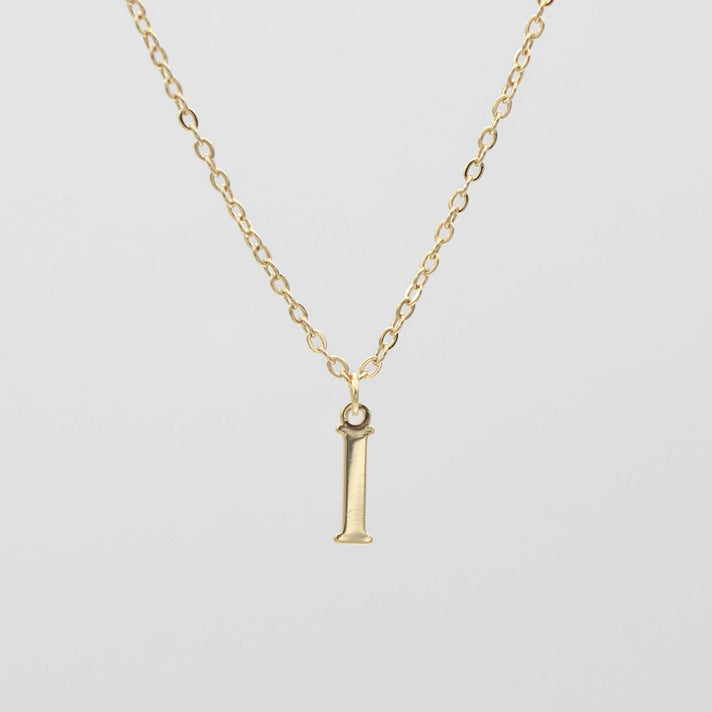 Gold plated initial necklace featuring the letter "I" on a delicate chain, perfect for personalization.