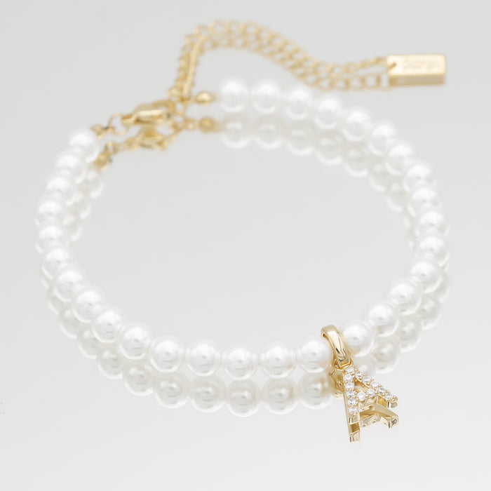 Gold initial anklet with pearls.