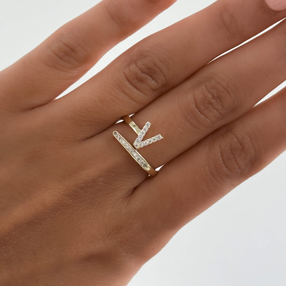 Model wearing Gold Paved, adjustable Icy initial ring in V