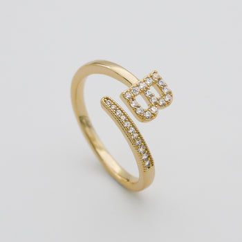 Model wearing Gold Paved, adjustable Icy initial ring in B