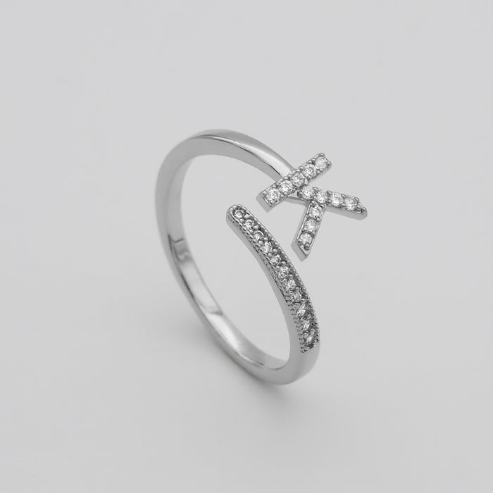Silver Paved, adjustable Icy initial ring in K