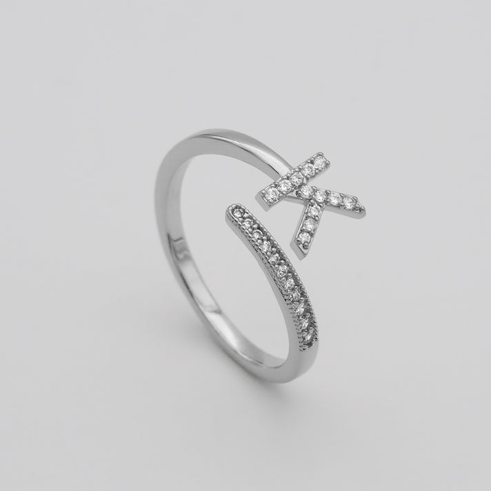 Silver Paved, adjustable Icy initial ring in K