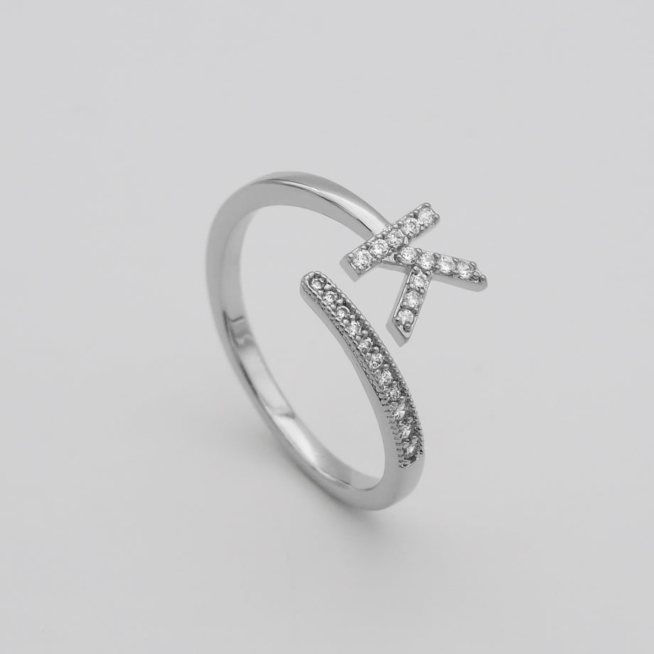 Silver Paved, adjustable Icy initial ring in K