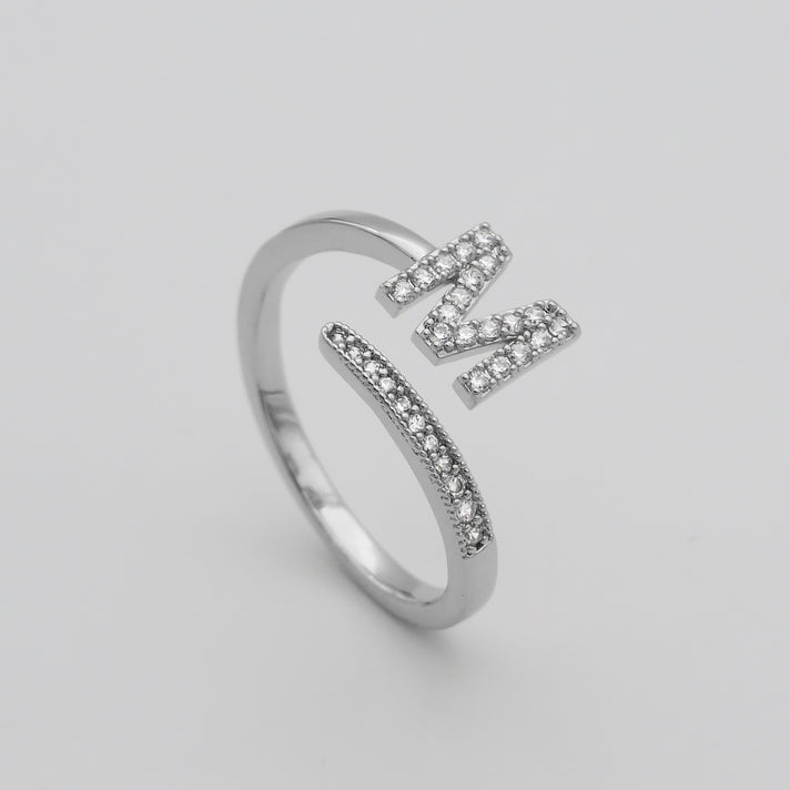 Silver Paved, adjustable Icy initial ring in M