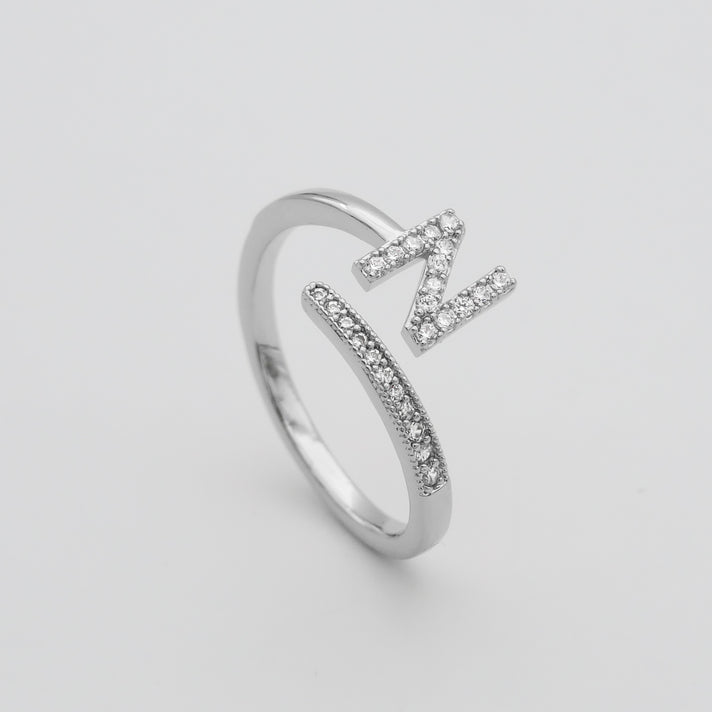 Silver Paved, adjustable Icy initial ring in N