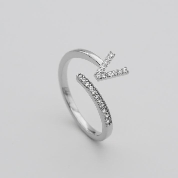 Silver Paved, adjustable Icy initial ring in V