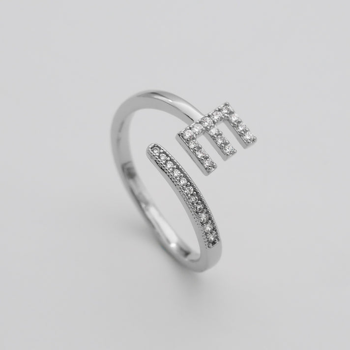 Silver Paved, adjustable Icy initial ring in E