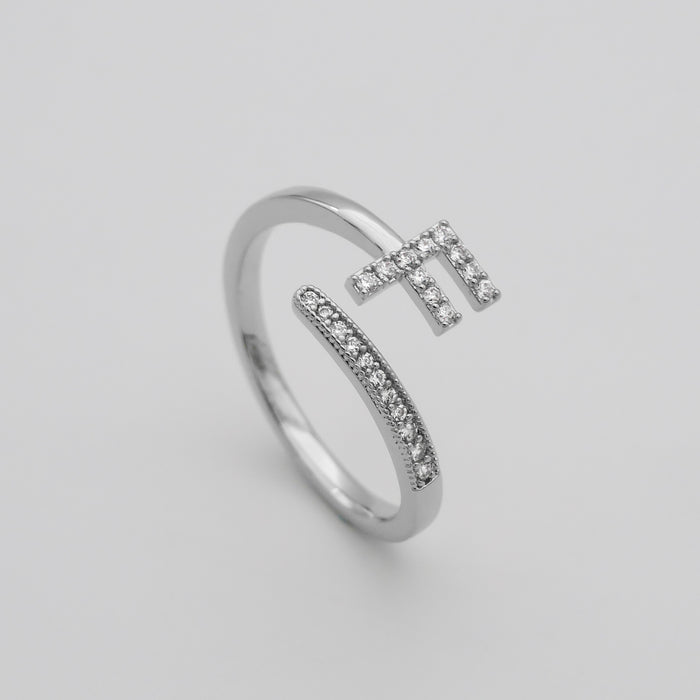 Silver Paved, adjustable Icy initial ring in F