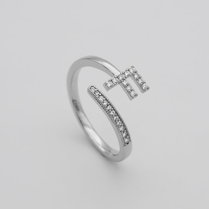 Silver Paved, adjustable Icy initial ring in F