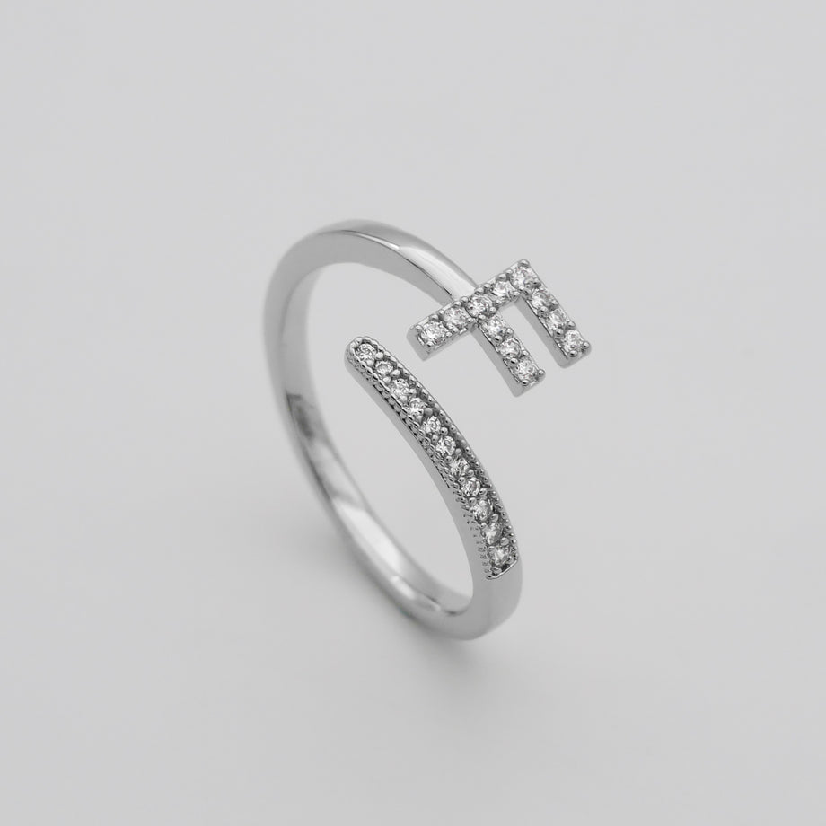 Silver Paved, adjustable Icy initial ring in F