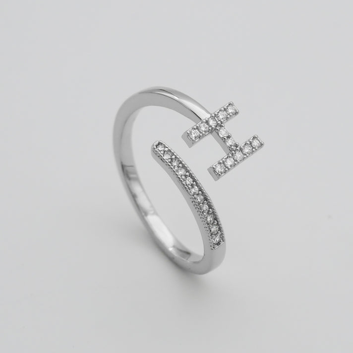 Silver Paved, adjustable Icy initial ring in H