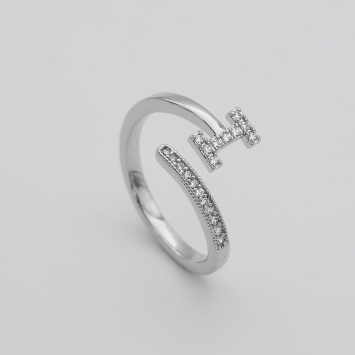 Silver Paved, adjustable Icy initial ring in I