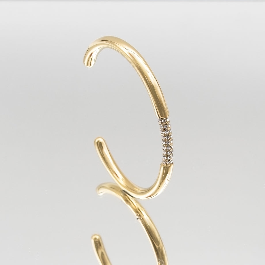 image of gold bangle with clear cz stones from prya