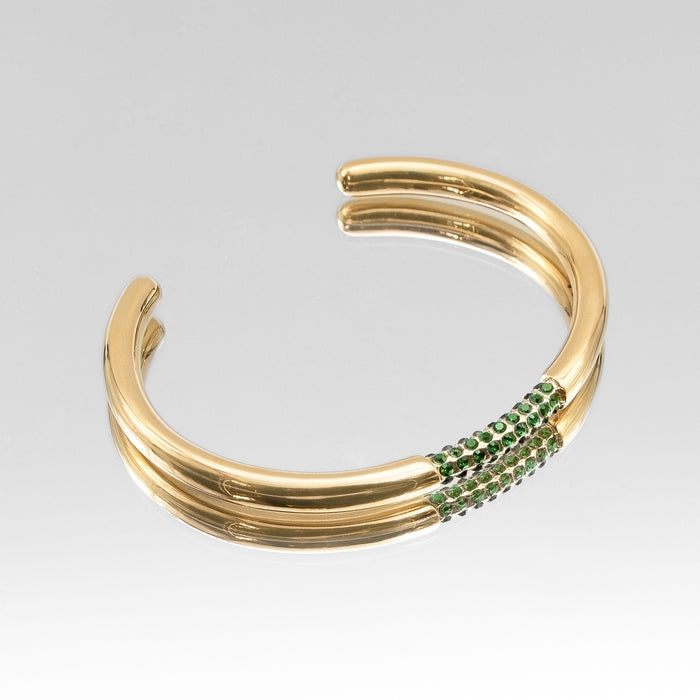image of gold bangle with emerald cz stones from prya
