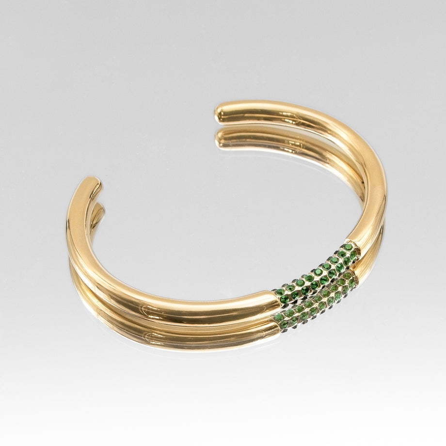 image of gold bangle with emerald cz stones from prya