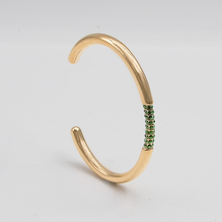 image of gold bangle with emerald cz stones from prya