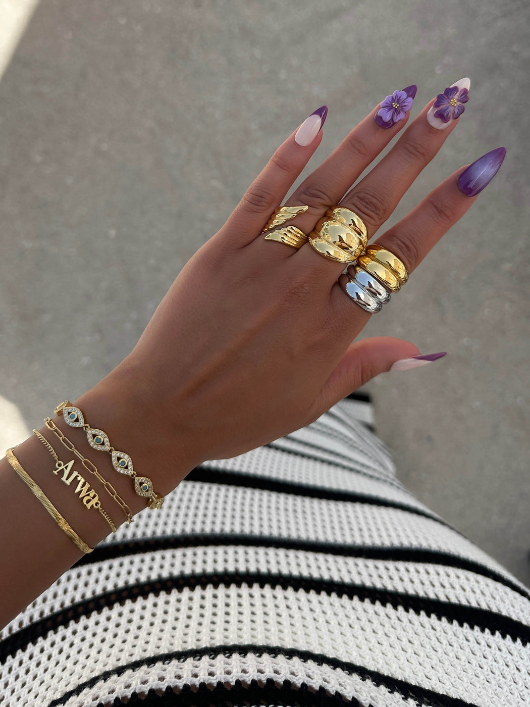 model wearing chunky rings and bracelet stacks from prya