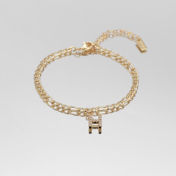icy Initial Anklet in gold on figaro chain from PRYA Jewellery UK