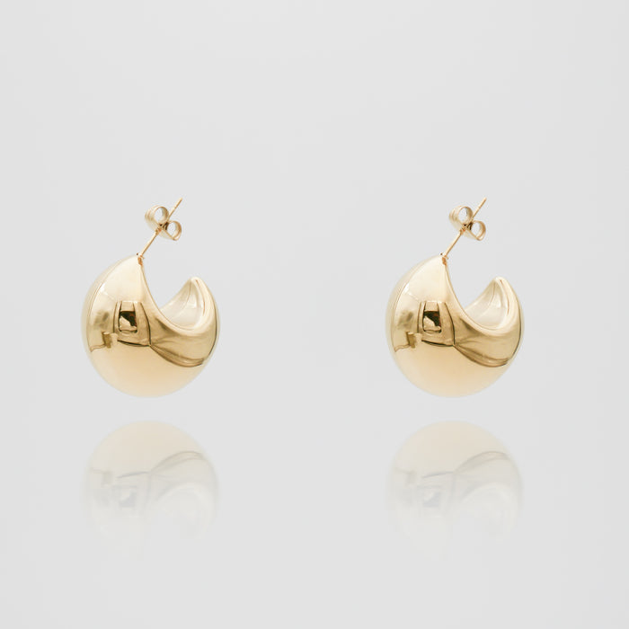 Gold Imani Earrings on white background.