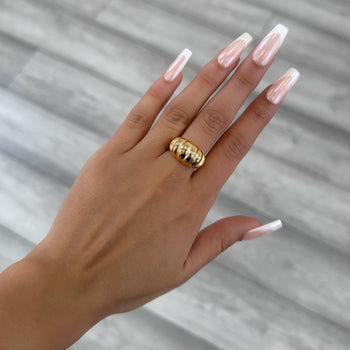 model wearing Inez Chunky Dome Ring, twisted crescent-inspired design crafted in 18k gold plated stainless steel from prya