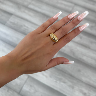 model wearing Inez Chunky Dome Ring, twisted crescent-inspired design crafted in 18k gold plated stainless steel from prya