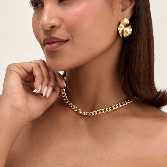 Model wearing Initial choker necklace in gold