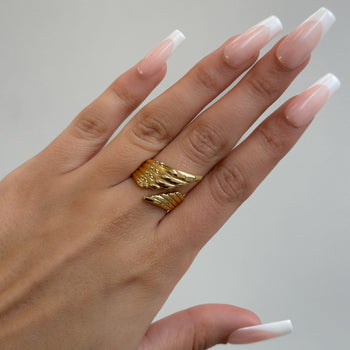 model wearing Irina Wing Wrap Ring crafted in 18k gold plated stainless steel from prya