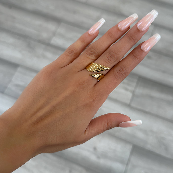 model wearing Irina Wing Wrap Ring crafted in 18k gold plated stainless steel from prya