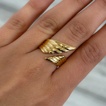 model wearing Irina Wing Wrap Ring crafted in 18k gold plated stainless steel from prya